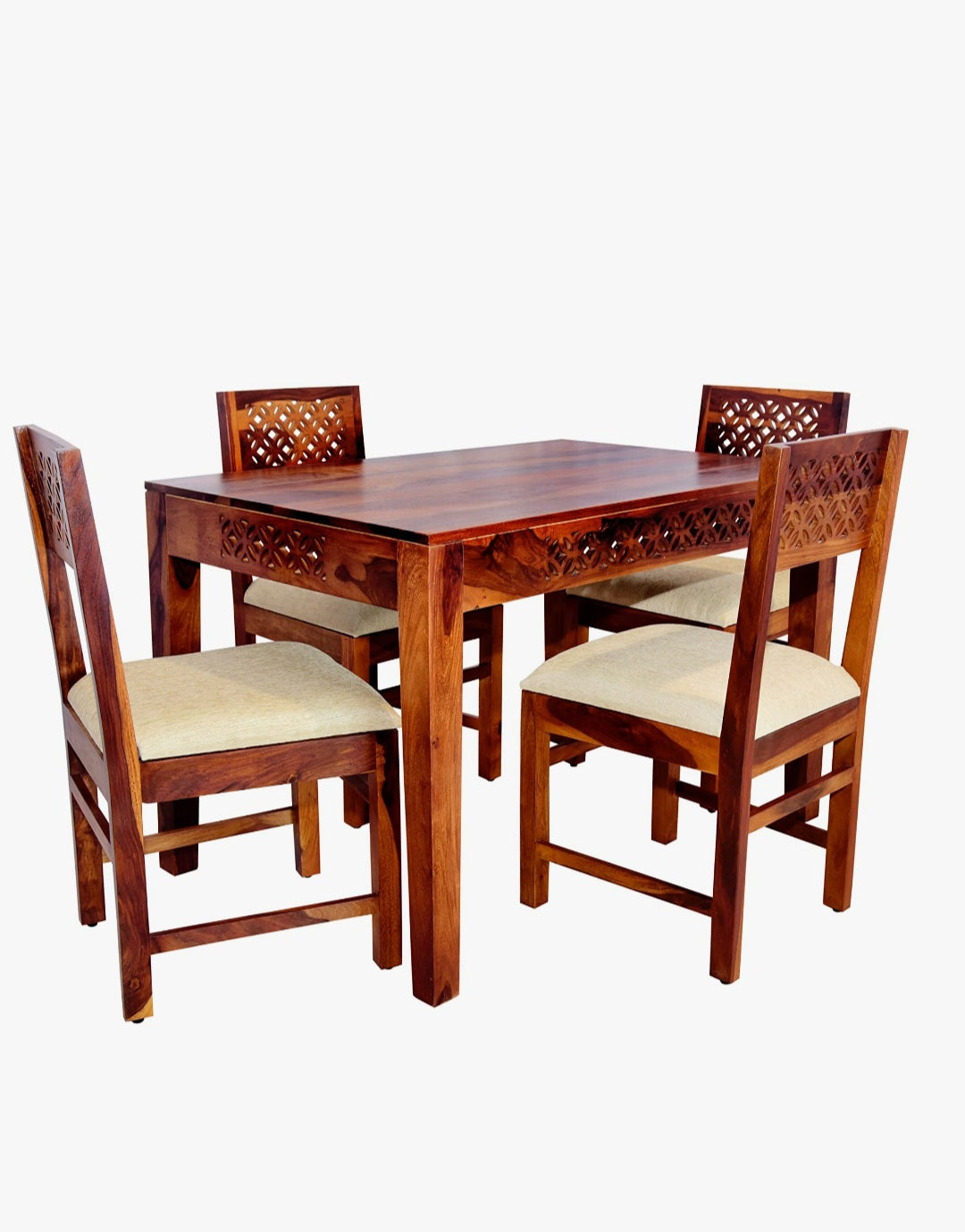 Sheesham wood dining table set with jigsaw cutting design and cushioned chairs, front view