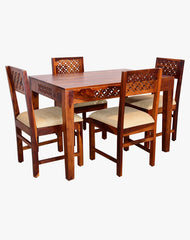 Jigsaw cutting design Sheesham wood dining table set with cushioned chairs, angled view