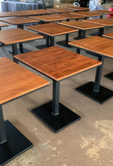 Two seater restaurant dining table front view with wooden top and iron base