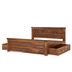 Wooden bed with storage drawers on a white background